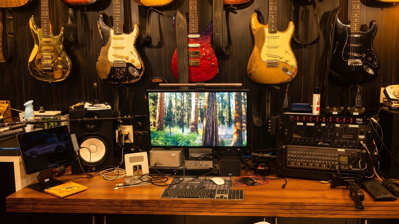 The desk under the guitar wall