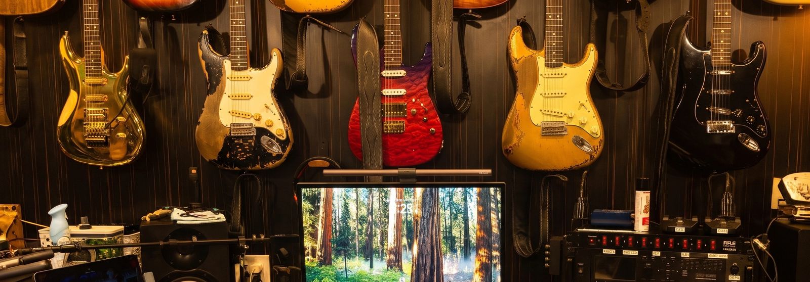 A wall of Stratocasters and Les Pauls